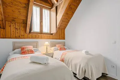 Cama o camas de una habitación en ICIAR - Dúplex by Cardi Suites