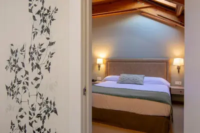 Cama o camas de una habitación en Hotel & Spa Real Jaca