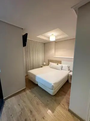 Cama o camas de una habitación en Hotel Pilar Plaza