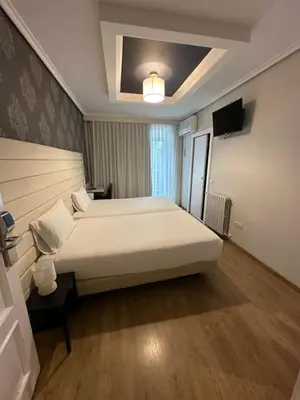 Cama o camas de una habitación en Hotel Pilar Plaza