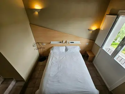 Cama o camas de una habitación en Hostal JP y Estudios