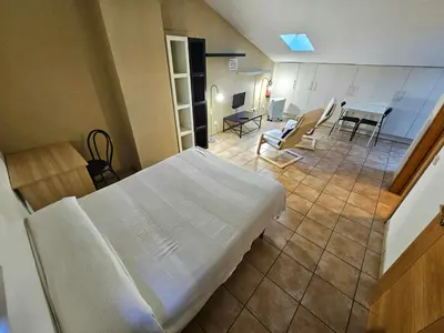 Cama o camas de una habitación en Hostal JP y Estudios