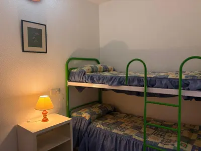 Cama o camas de una habitación en Práctico y rústico, perfecto para parejas - Cuc 7