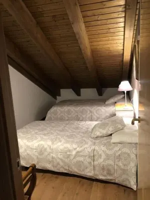 Cama o camas de una habitación en Casa Sesué ideal para familias