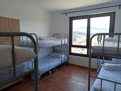 Cama o camas de una habitación en Albergue de Sos del Rey Católico