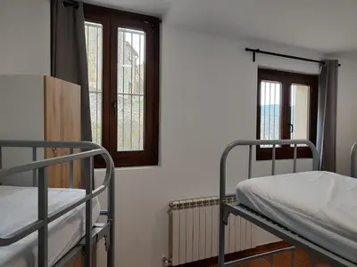 Cama o camas de una habitación en Albergue de Sos del Rey Católico