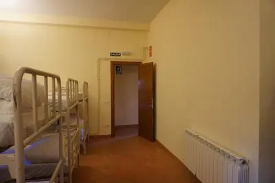 Cama o camas de una habitación en Albergue de Sos del Rey Católico
