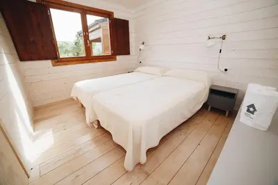 Cama o camas de una habitación en Vall d'Àger Resort & Camping