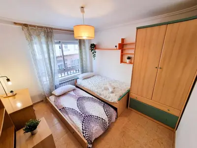 Cama o camas de una habitación en El Reloj del Pilar ComoTuCasa