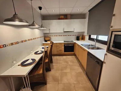 Una cocina o zona de cocina en Mar y Montaña Masboquera