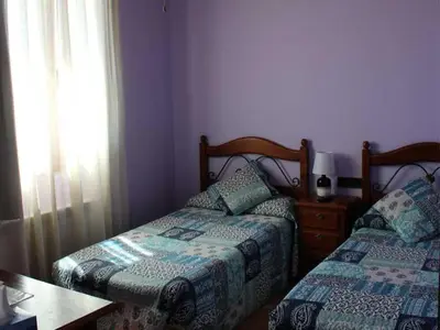 Cama o camas de una habitación en HOSTAL LA SAVINA