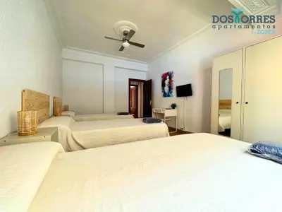 Cama o camas de una habitación en Dos Torres Saruman - Espacioso con 7 Camas Individuales